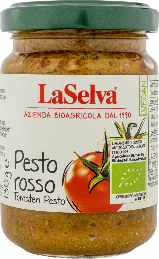 Entfalte den Geschmack Italiens in deiner Küche mit La Selva Pesto Rosso. Dieses köstliche, nussige Pesto, hergestellt aus sonnengetrockneten Tomaten und knackigen Cashewnüssen, verfeinert mit hochwertigem Olivenöl extravergine, ist die perfekte Ergänzung zu deinen Lieblingsgerichten. Ob als raffinierter Twist auf frischem Brot, als geschmackvolle Basis für Suppen oder als kreative Alternative zu klassischen Tomatensaucen – dieses Pesto rosso bringt Vielfalt und Genuss auf deinen Tisch.