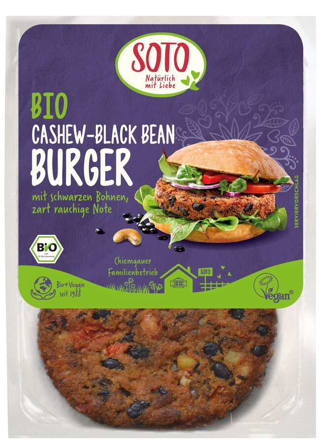 Begeistere deine Sinne mit dem SOTO Burger Cashew-Black Bean, einer köstlichen Kreation, die die nussige Eleganz von Cashews mit der satten Fülle schwarzer Bohnen vereint, abgerundet durch eine subtile rauchige Note. Ob als Highlight beim nächsten Grillfest oder als schnelle Mahlzeit – dieser Bio-Burger lässt sich sowohl warm als auch kalt genießen. Ideal für Genießer, die auf der Suche nach geschmackvoller Vielfalt sind. Perfekt für alle, die vegane Ernährung abwechslungsreich und spannend gestalten möchten.